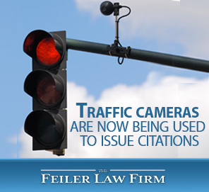 Traffic Cameras are Now Being Used to Issue Citations in Miami-Dade County to Prevent Reckless Driving Picture of a Traffic Light with A Camera to Combat Reckless Driving in Miami